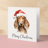 Fun Christmas Card of a Dachshind Dog Wearing A Santa Hat Whimsical Watercolour Christmas Card For Animal Lover For Him or Her