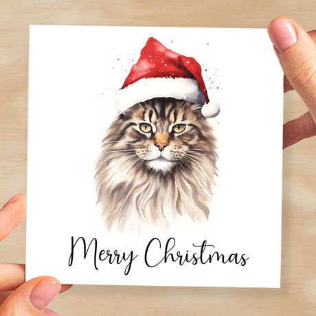 Fun Christmas Card of a Maine Coon Cat Wearing A Santa Hat Whimsical Watercolour Christmas Card For Animal Lover For Him or Her