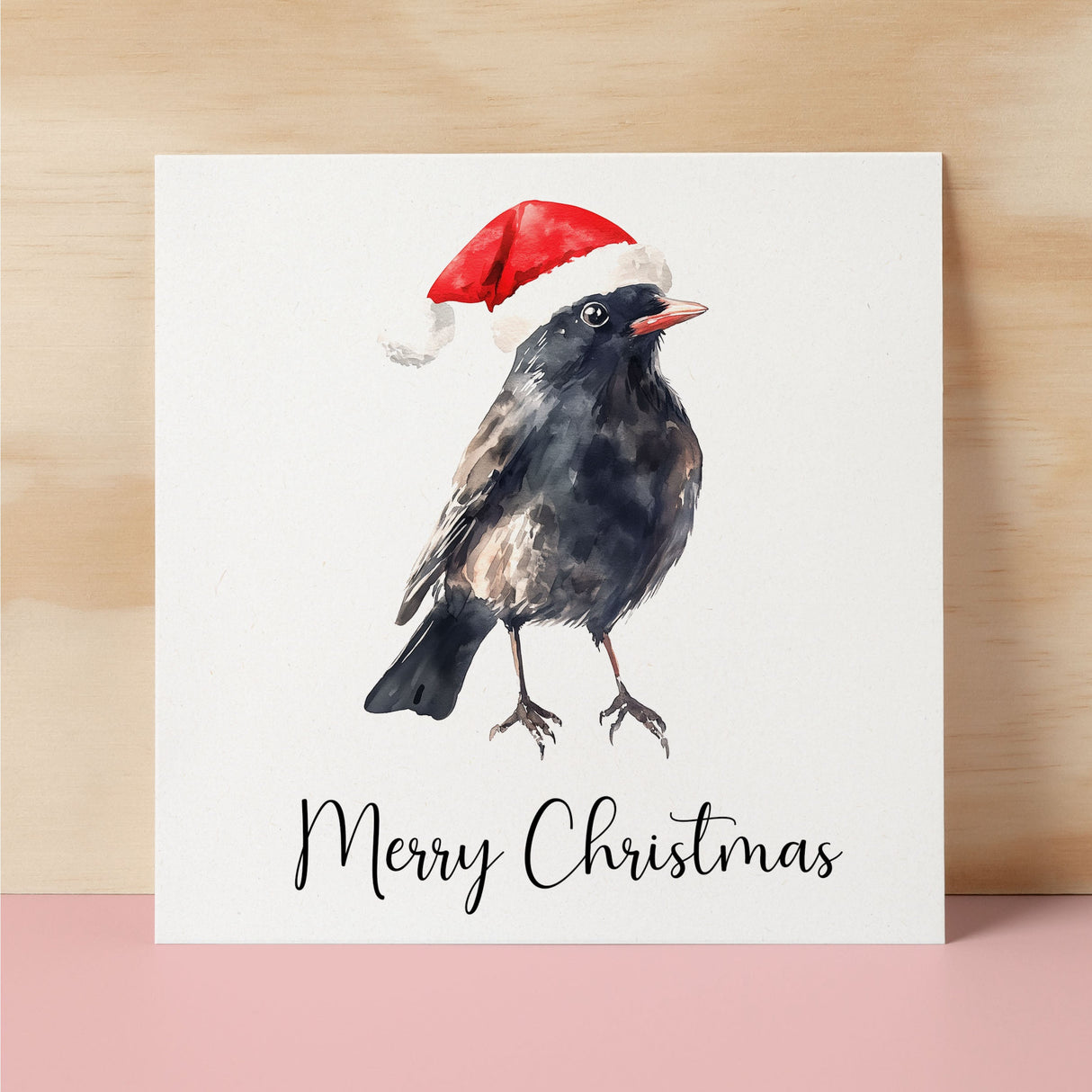 Fun Christmas Card of a Black Bird Wearing A Santa Hat Whimsical Watercolour Christmas Card For Bird Lover For Him or Her