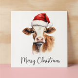 Fun Christmas Card of a Cow Wearing A Santa Hat Whimsical Watercolour Christmas Card For Animal Lover For Him or Her