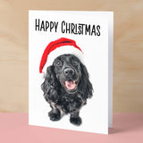 Fun Christmas Card of a Black Cocker Spaniel Dog Wearing A Santa Hat Whimsical Christmas Card For Animal Lover For Him or Her