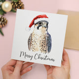 Fun Christmas Card of a Peregrine Falcon Wearing A Santa Hat Whimsical Watercolour Christmas Card For Bird Lover For Him or Her